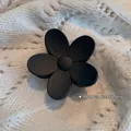 Matte black floral hair claw clip 6cm size shown on a white knitted fabric background - Flower Style (12# Matte)