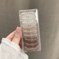 Lot de 9 élastiques à cheveux spirales dégradé marron dans leur boîte transparente - Champagne