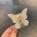 Elegant butterfly hair claw clip in pearlescent cream white with a gold metal spring - Aurora White