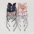Flat lay of ten diverse floral and patterned bow bunny ear headbands for girls - Style 6 (10-Piece Set)