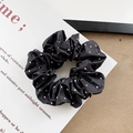 Polka dot satin scrunchie in black and white fabric for elegant hair styling - Black