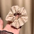 Elegant champagne gold satin scrunchie with smooth silk texture for women - Khaki