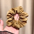 Elegant bronze gold satin scrunchie with a glossy silk texture and layered pleats - Ginger Yellow