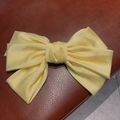 Elegant large yellow satin bow hair claw clip for thick hair with glossy finish - Light Yellow