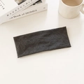 Minimalist dark gray knitted high elasticity sports headband on a cozy desk setting - Gray