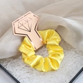 Vibrant yellow satin silk scrunchie displayed on a premium gold diamond card - Bright Yellow