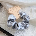 Silver grey satin silk scrunchie with metallic finish on a pink diamond display card - Gray