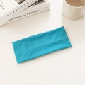 Bright blue elastic cotton sports headband for running and yoga flat on desk - Lake Blue