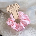Pink satin scrunchie presented on a unique diamond-ring shaped display card holder - Pink