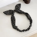 Elastisches Blumen-Haarband mit Gänseblümchen-Muster und schwarzen Hasenohren - Schwarz