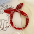 Red paisley print headband with elastic band and adjustable bunny ear knot detail - Red