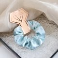 Light blue satin scrunchie on a rose gold diamond card presented in a glass tray - Light Green