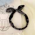 Elastic knot headband with black paisley print and bunny ear design for women - Black