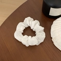 Elegant white floral chiffon scrunchie with soft ruffled pleats on a wooden table - Solid White Pleated Design (3#)
