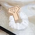 Elegant white satin silk scrunchie on a decorative display card with water ripple glass - White