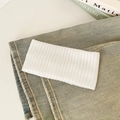 Elastic white knitted ribbed headband for women with soft vertical texture on denim jeans - White
