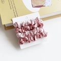 Set of four soft pink and rose satin hair scrunchies on a white display card - Pink and Red Splicing