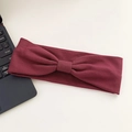 Elastic burgundy knitted yoga headband with a decorative center knot for women - Burgundy