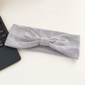 Light grey elastic knitted sport headband with a twisted knot on white background - Light Gray