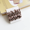 Three-piece set of satin hair scrunchies in champagne and brown on a display card - Dark and Light Coffee Splicing