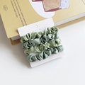 Set of four sage green satin silk hair scrunchies on elegant display card - Dark and Light Green Splicing