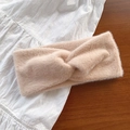 Soft beige faux fur headband featuring a stylish twisted cross design for winter warmth - Khaki