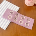 Purple ribbed knit headband with silver metal eyelets in a lifestyle desk setting - Light Purple