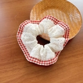 Sweet white lace scrunchie with red plaid edges and pleated design on a wooden desk - Red Plaid Lace Patchwork