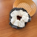 Lace scrunchie with floral pattern in black and orange on dark wooden surface - Black Floral Lace Patchwork