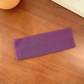 Minimalist purple knitted elastic headband with vertical ribbed texture on wood surface - Deep purple