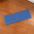 Elastic blue ribbed knit headband for yoga and sports on a dark wooden surface - Sapphire Blue