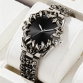 Punk style men's watch with silver claw bezel and black dial on display pillow - Black