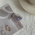 Detail of oval resin hair clip with purple glitter and elegant metallic stacking rings - Blue Small Oval