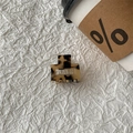 Close-up of a square tortoiseshell acetate hair claw clip with a hollow center design - Light Leopard