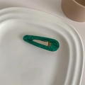 Detailed macro of dark green marble acetate hair clip with gold metal duckbill clamp - Starry Green Water Drop