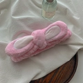 Close-up of pink plush bunny ear headband made of soft coral fleece for skincare - Pink Bowknot Rabbit Ear