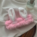 Close-up of soft pink coral fleece headband with bunny ears for face washing - Pink Bunny Ears