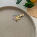 Detailed close-up of a dreamy gradient star-shaped hair clip with gold metal duckbill clamp - Gold Aurora Blue