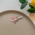 Close-up of pink star-shaped marble pattern acetate hair clip with silver metal clip - Silver Aurora Pink
