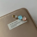 Detail of elegant bobby pin with gold star, blue gemstone, and pink pearl accents - Light Blue Rhombus