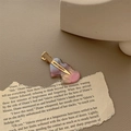Detail of heart-shaped marble acetate hair clip with pink and purple pearlescent finish - Iridescent Pink (Gold Clip)