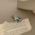 Close-up of black and white marble texture resin hair clip on golden base - Milk Pattern (Gold Clip)