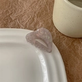 Detail of lavender marble texture hair claw clip on a white ceramic plate edge - Light Gray