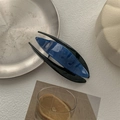 Detail of blue and black acetate hair claw clip on a minimalist artistic background - Noble Royal Blue