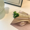 Detail of a dark green translucent acetate hair claw clip with smooth polished edges - Small Semicircle Hollow