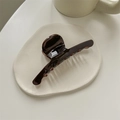 Detail of chocolate brown hair claw featuring golden Handmade in France lettering - Bar Shape / Chocolate Brown