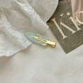 Detail of a light cyan marble textured hair clip with gold metal base on background - Iridescent Blue Green