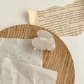 Close-up of heart-shaped acetate hair claw clip with golden France Handmade text - Pearl White
