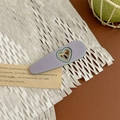 Detail view of a matte purple heart-shaped hair claw clip with dark green edges and gold clip - Heart Duckbill Clip - Purple
