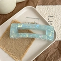 Detail of light blue iridescent square hair claw clip with marble texture and glitter - Colorful Blue Green - 12.5cm